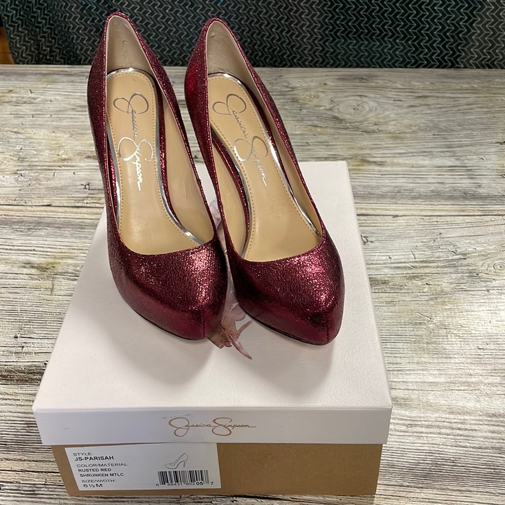 Jessica Simpson real leather. Rusted red sparkly pumps wore once
